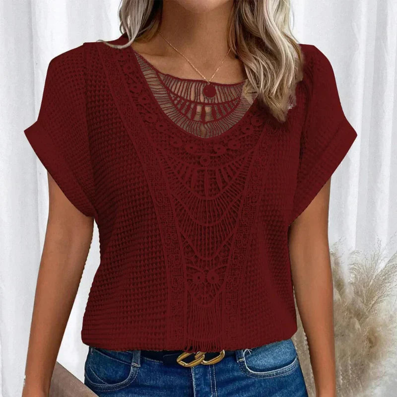 Women's blouse featuring a decorative crochet neckline and short sleeves. 10