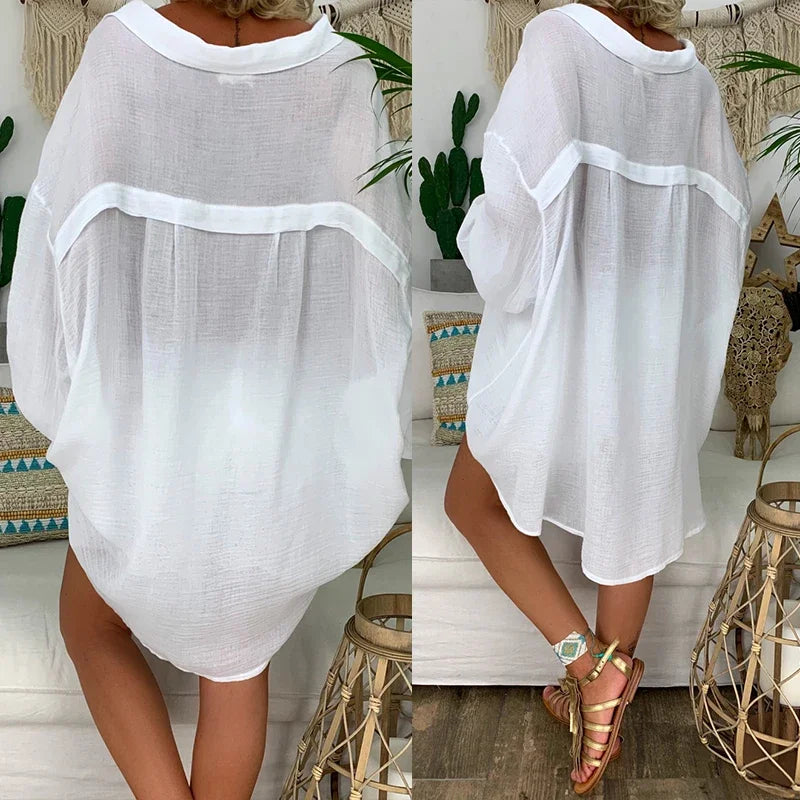 Oversized women's white long-sleeve shirt featuring a classic collar. 5