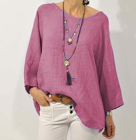 Loose women's long-sleeve blouse with a round neckline, featuring a relaxed fit and elegant design. 4