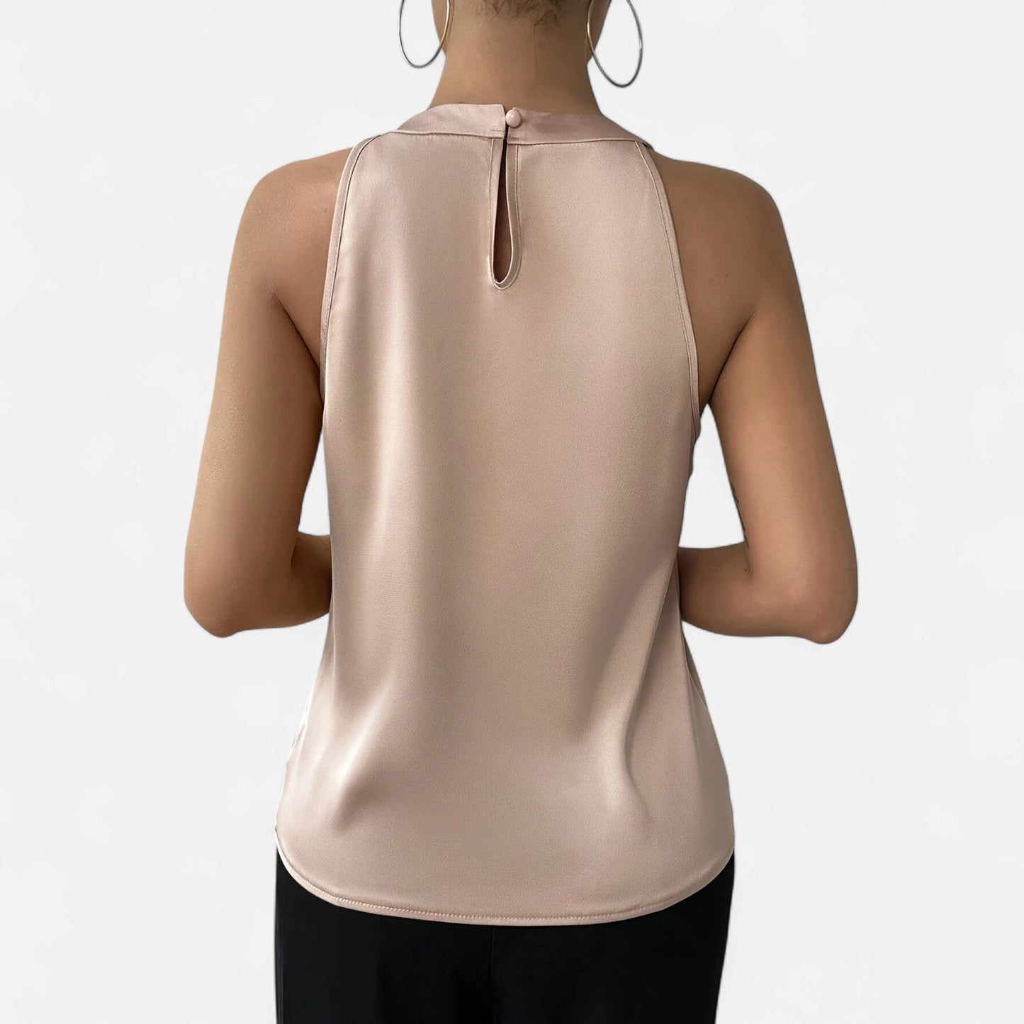 Women's sleeveless vest featuring a pleated front and draped pattern design. 6