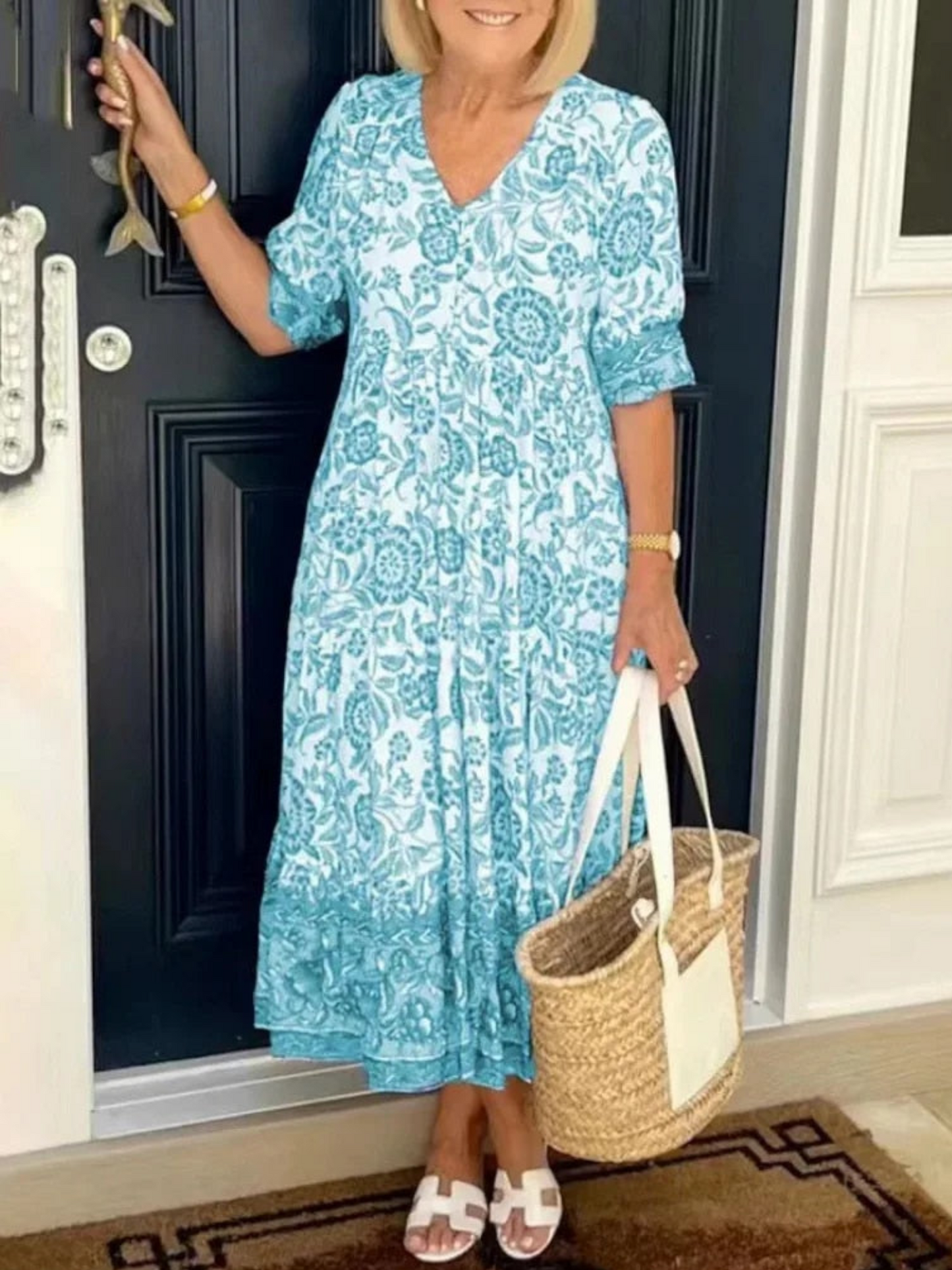 Maxi dress featuring a floral design with a flowing silhouette, suitable for summer wear. 5