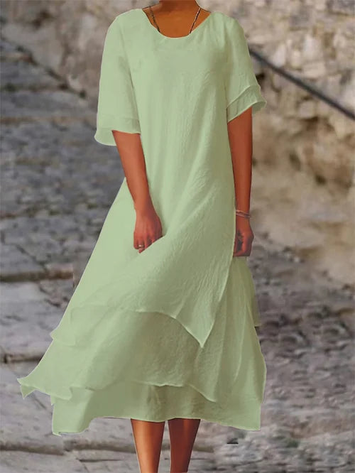 Lightweight women's dress with short sleeves and a stylish cut, featuring a fitted bodice and a flared skirt design. 7