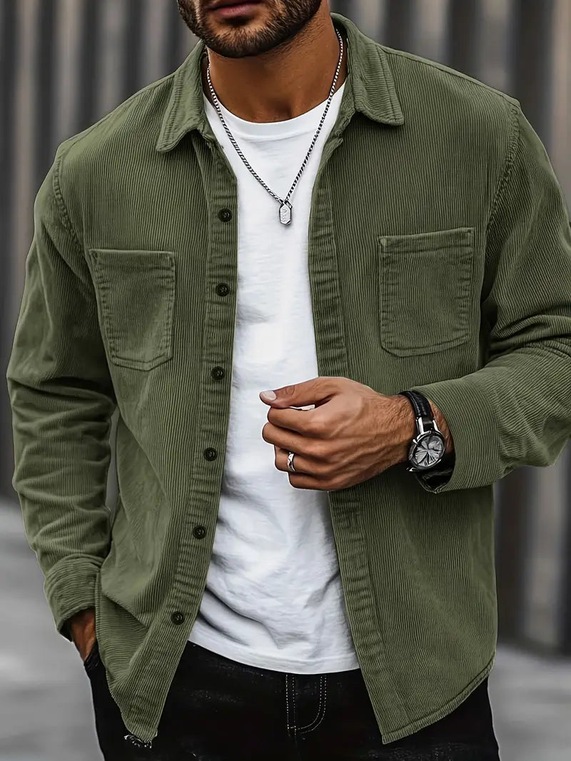 Men's corduroy shirt in a relaxed fit displayed on a hanger, showcasing the textured fabric and button-down collar. 3
