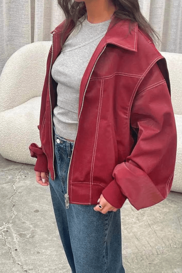 Women's oversized bomber jacket featuring contrast stitching details. 7