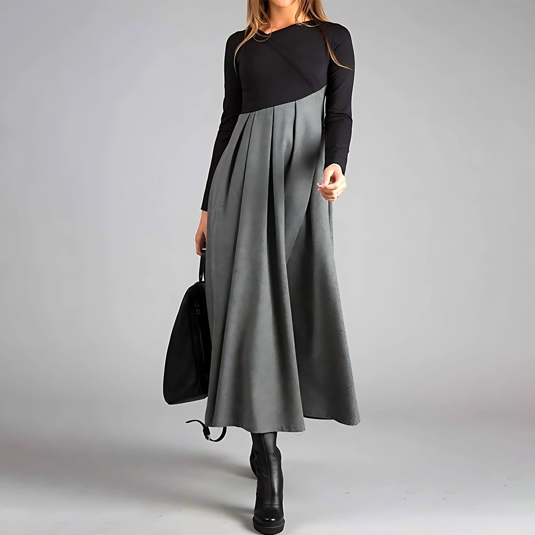 Maxi dress with long sleeves and a pleated bottom, designed for formal occasions like weddings. 0