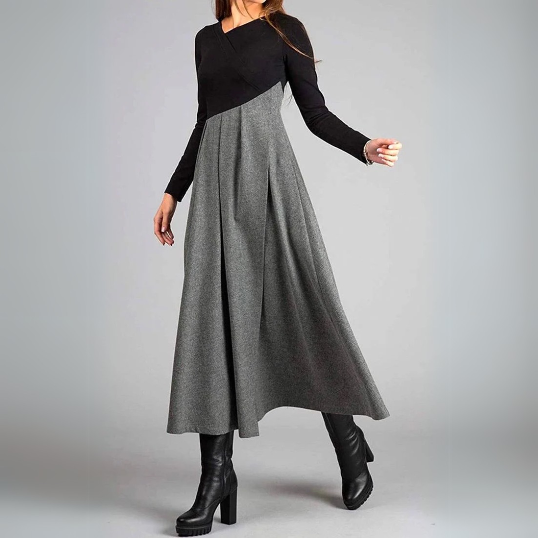 Maxi dress with long sleeves and a pleated bottom, designed for formal occasions like weddings. 1