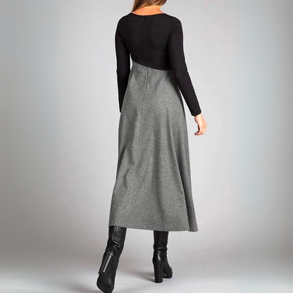 Maxi dress with long sleeves and a pleated bottom, designed for formal occasions like weddings. 2