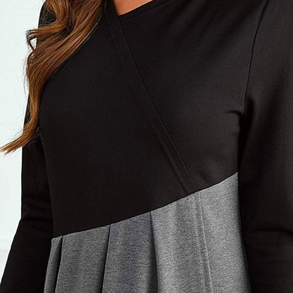 Maxi dress with long sleeves and a pleated bottom, designed for formal occasions like weddings. 3