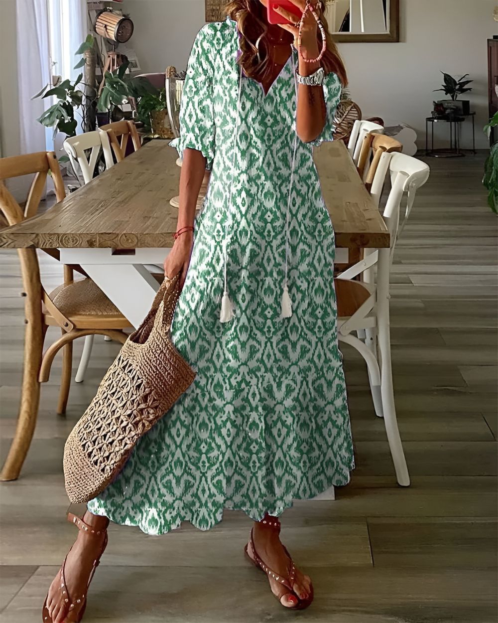 A bohemian style dress with a loose fit and playful patterns, designed for women. The dress features a flowing silhouette and a vibrant print, suitable for 1