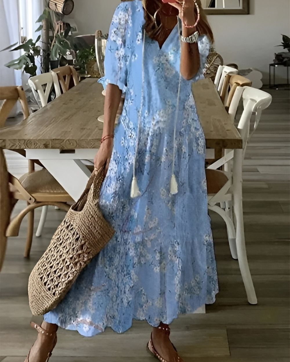 A bohemian style dress with a loose fit and playful patterns, designed for women. The dress features a flowing silhouette and a vibrant print, suitable for 3
