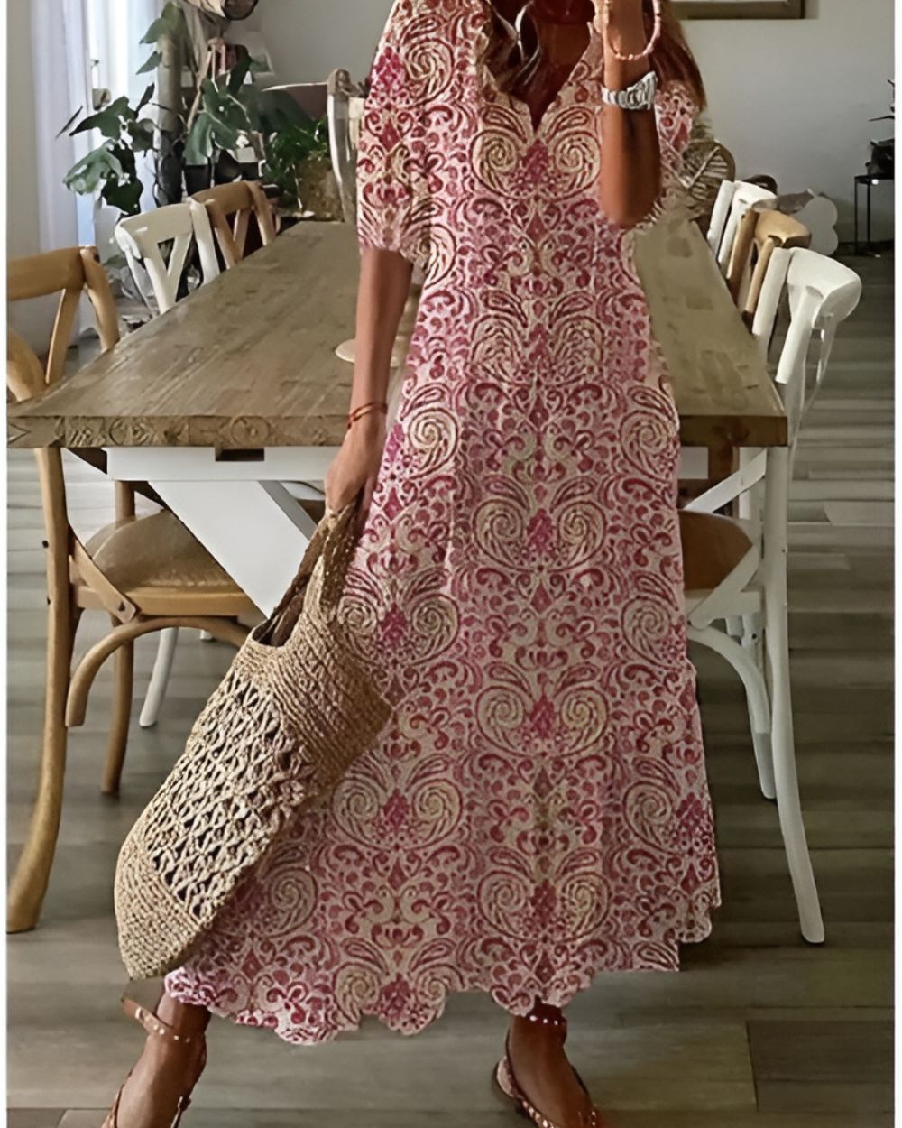 A bohemian style dress with a loose fit and playful patterns, designed for women. The dress features a flowing silhouette and a vibrant print, suitable for 4