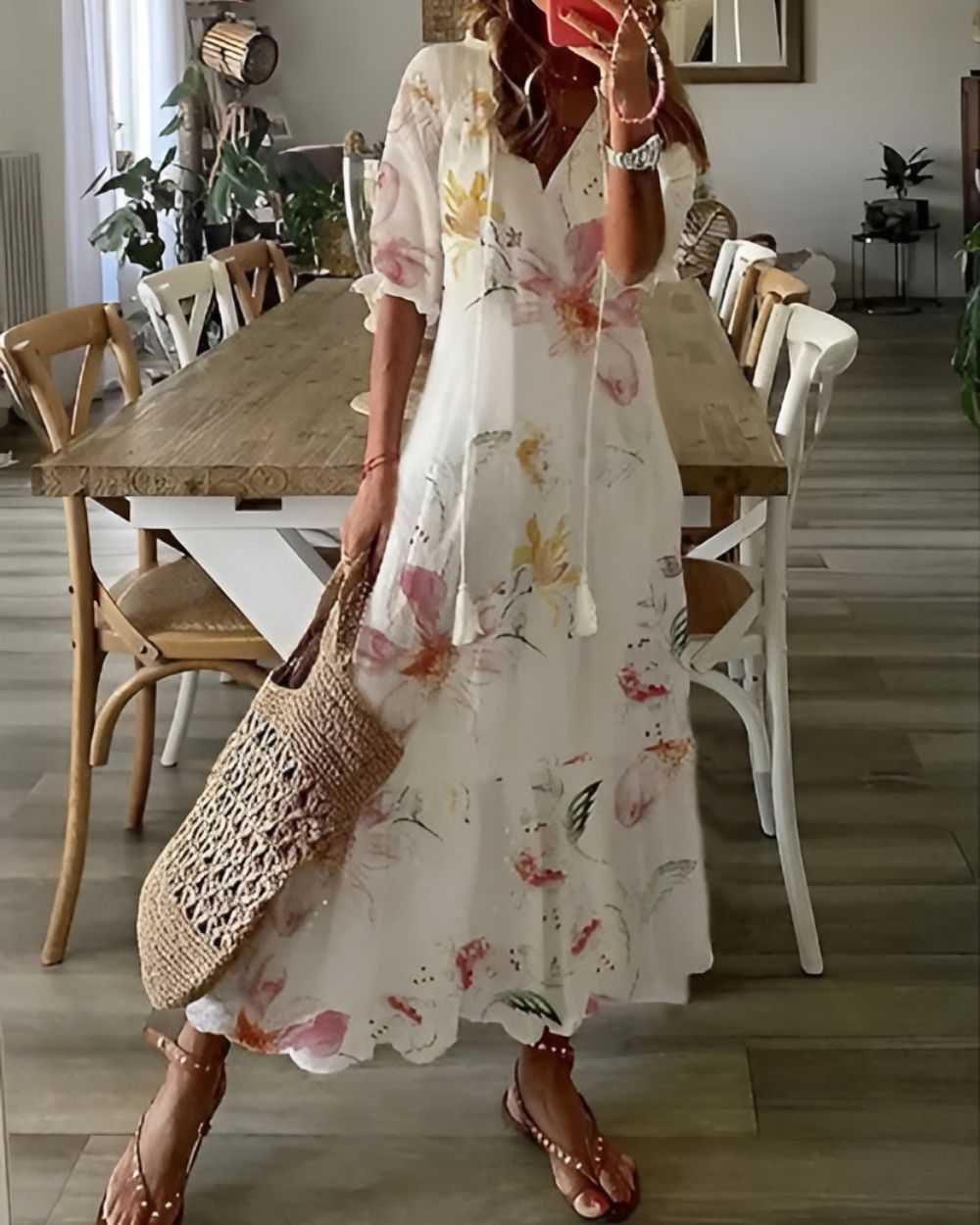 A bohemian style dress with a loose fit and playful patterns, designed for women. The dress features a flowing silhouette and a vibrant print, suitable for 5