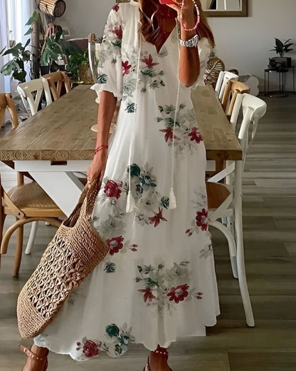 A bohemian style dress with a loose fit and playful patterns, designed for women. The dress features a flowing silhouette and a vibrant print, suitable for 7