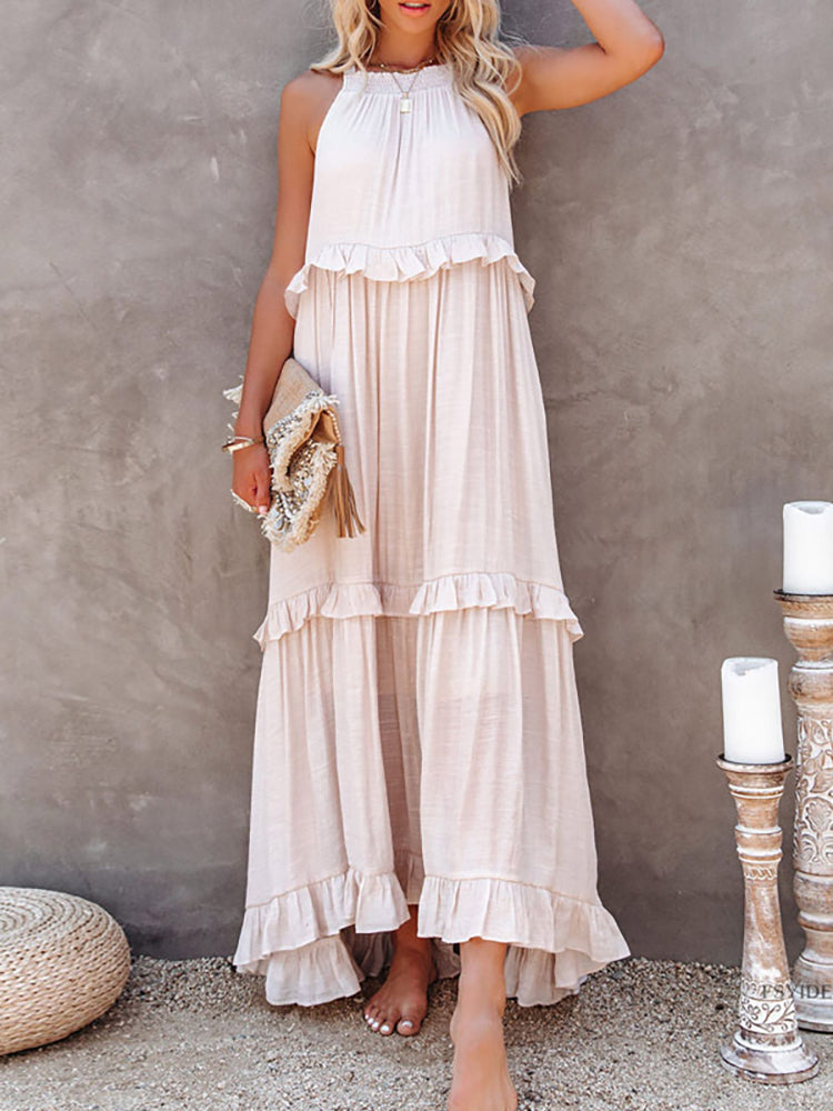 A women's sleeveless A-line dress with ruffles, designed for weddings and summer events. 1