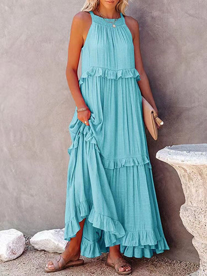A women's sleeveless A-line dress with ruffles, designed for weddings and summer events. 2