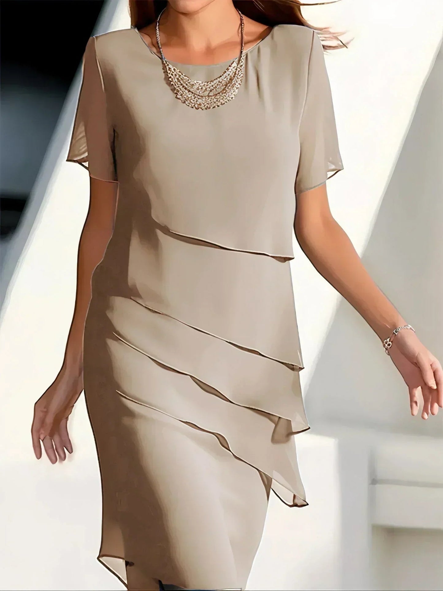 A mid-length evening dress designed for women, featuring a structured waistline and a flowing skirt. The dress has a fitted bodice and offers a sophisticated 3