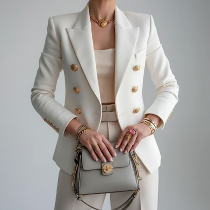 A women's black double-breasted blazer featuring gold buttons, displayed on a hanger against a neutral background. 0