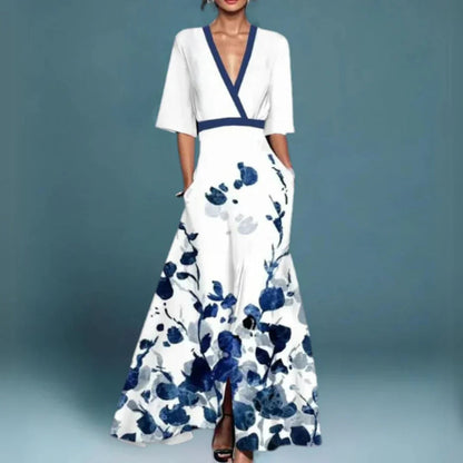 Maxi dress featuring a floral pattern and a flowing silhouette, designed for formal occasions such as weddings. 1