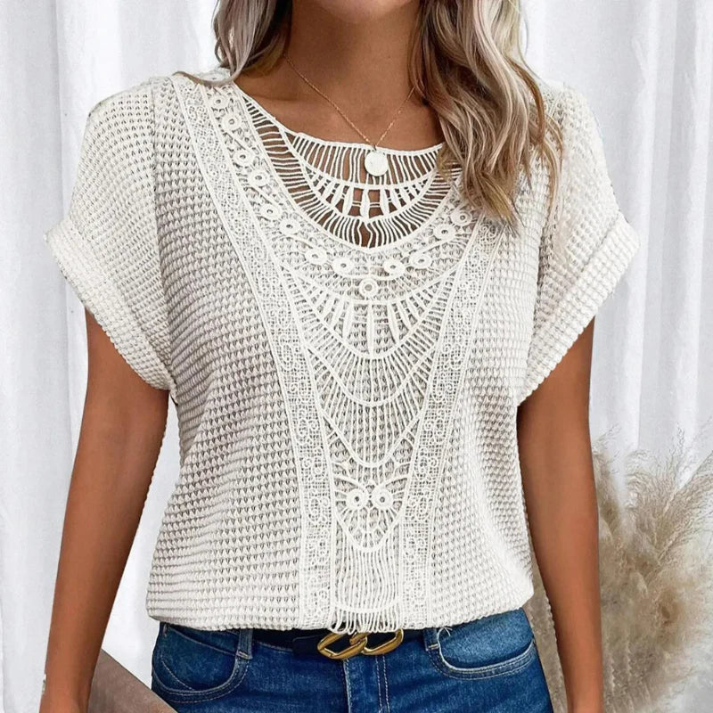 Women's blouse featuring a decorative crochet neckline and short sleeves. 9