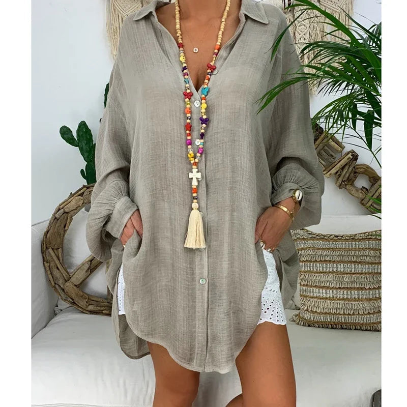 Oversized women's white long-sleeve shirt featuring a classic collar. 0