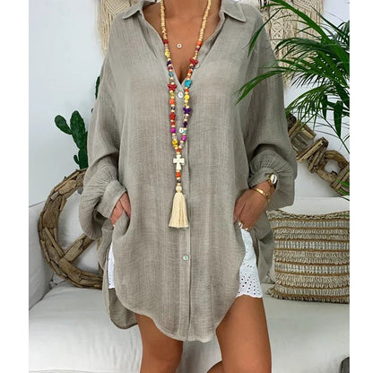 Oversized women's white long-sleeve shirt featuring a classic collar. 0