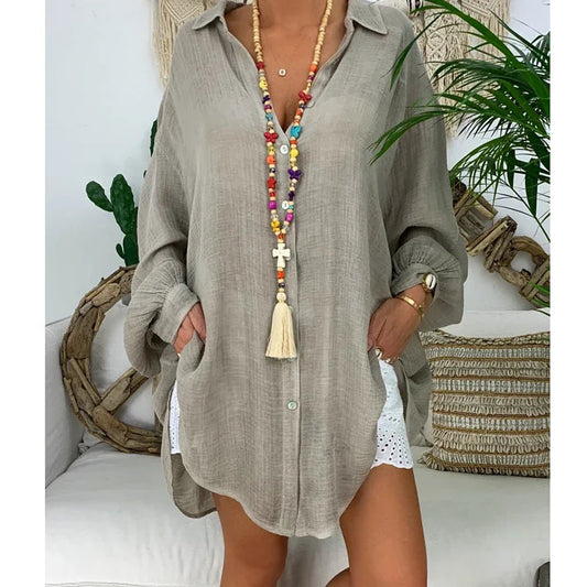 Oversized women's white long-sleeve shirt featuring a classic collar. 0