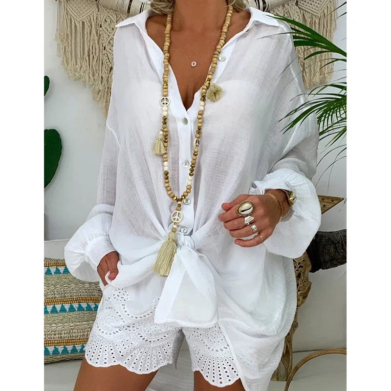 Oversized women's white long-sleeve shirt featuring a classic collar. 1