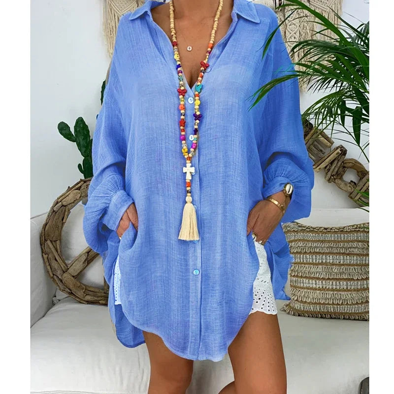 Oversized women's white long-sleeve shirt featuring a classic collar. 2