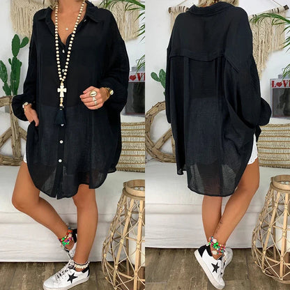 Oversized women's white long-sleeve shirt featuring a classic collar. 4