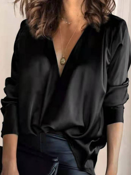 Elegant women's blouse with a V-neck and long sleeves, featuring a fitted design and subtle detailing. 0
