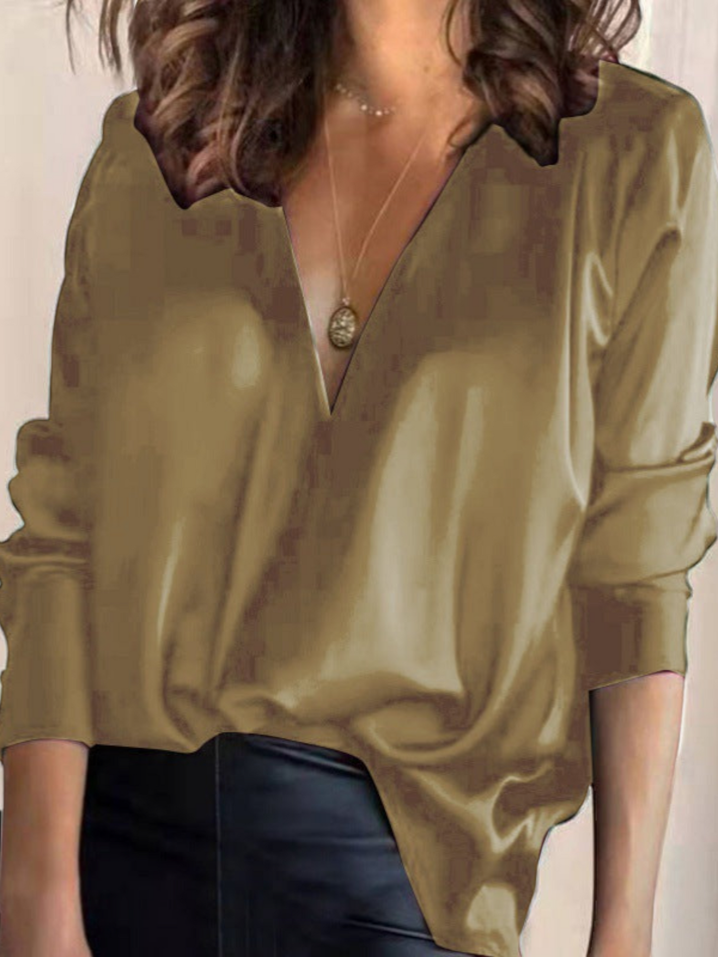 Elegant women's blouse with a V-neck and long sleeves, featuring a fitted design and subtle detailing. 7