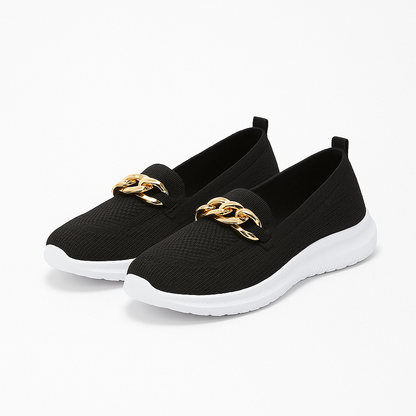 Women's knit shoes featuring a gold chain detail and a white sole. 4
