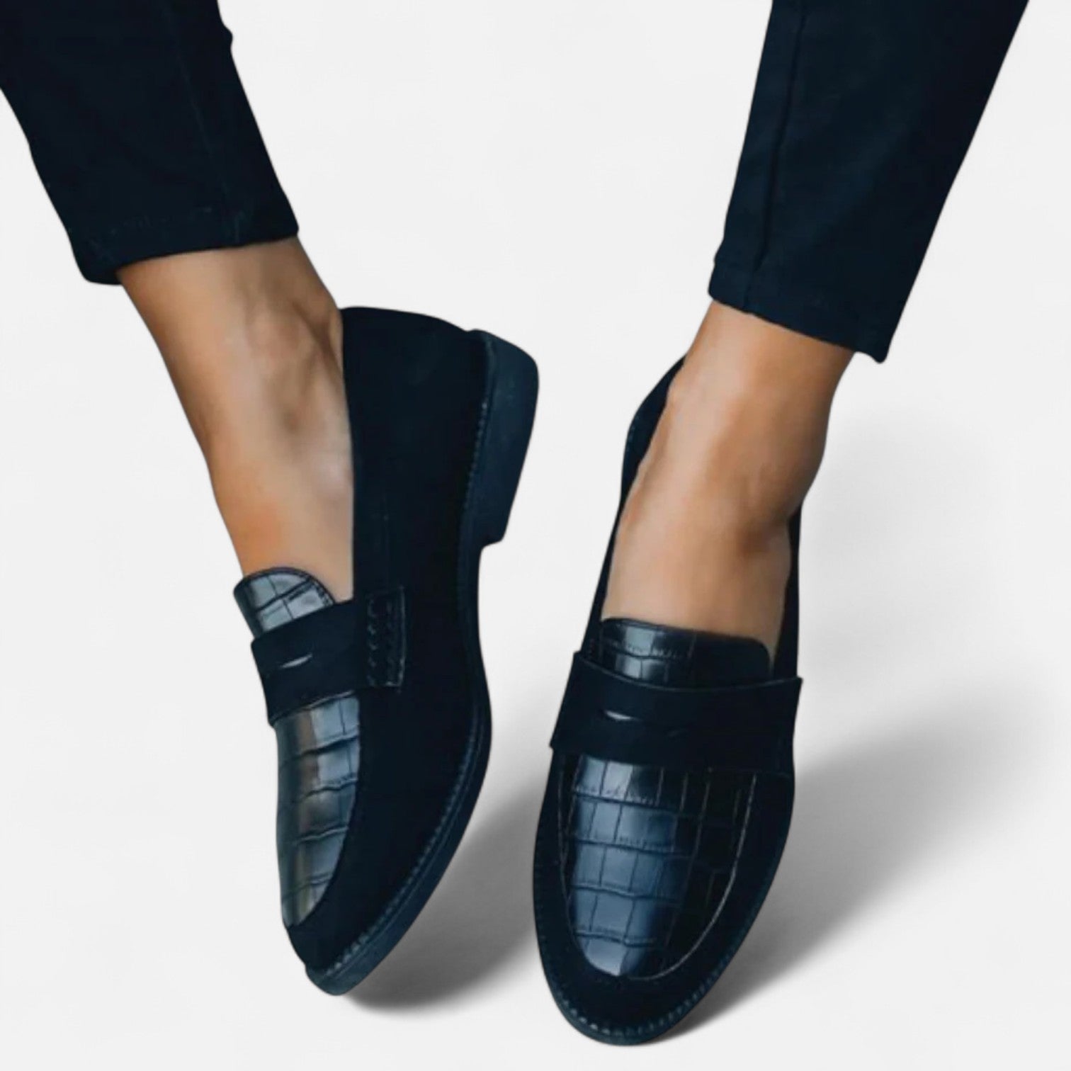 Women's leather loafers featuring a classic design, showcasing a sleek silhouette and minimalistic style. 4