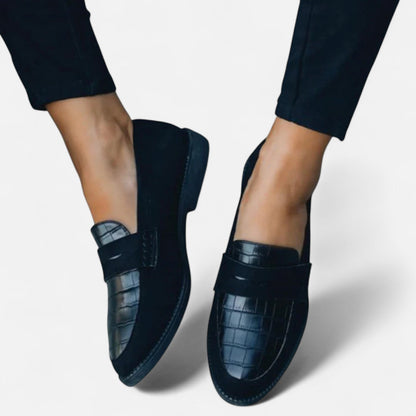 Women's leather loafers featuring a classic design, showcasing a sleek silhouette and minimalistic style. 4
