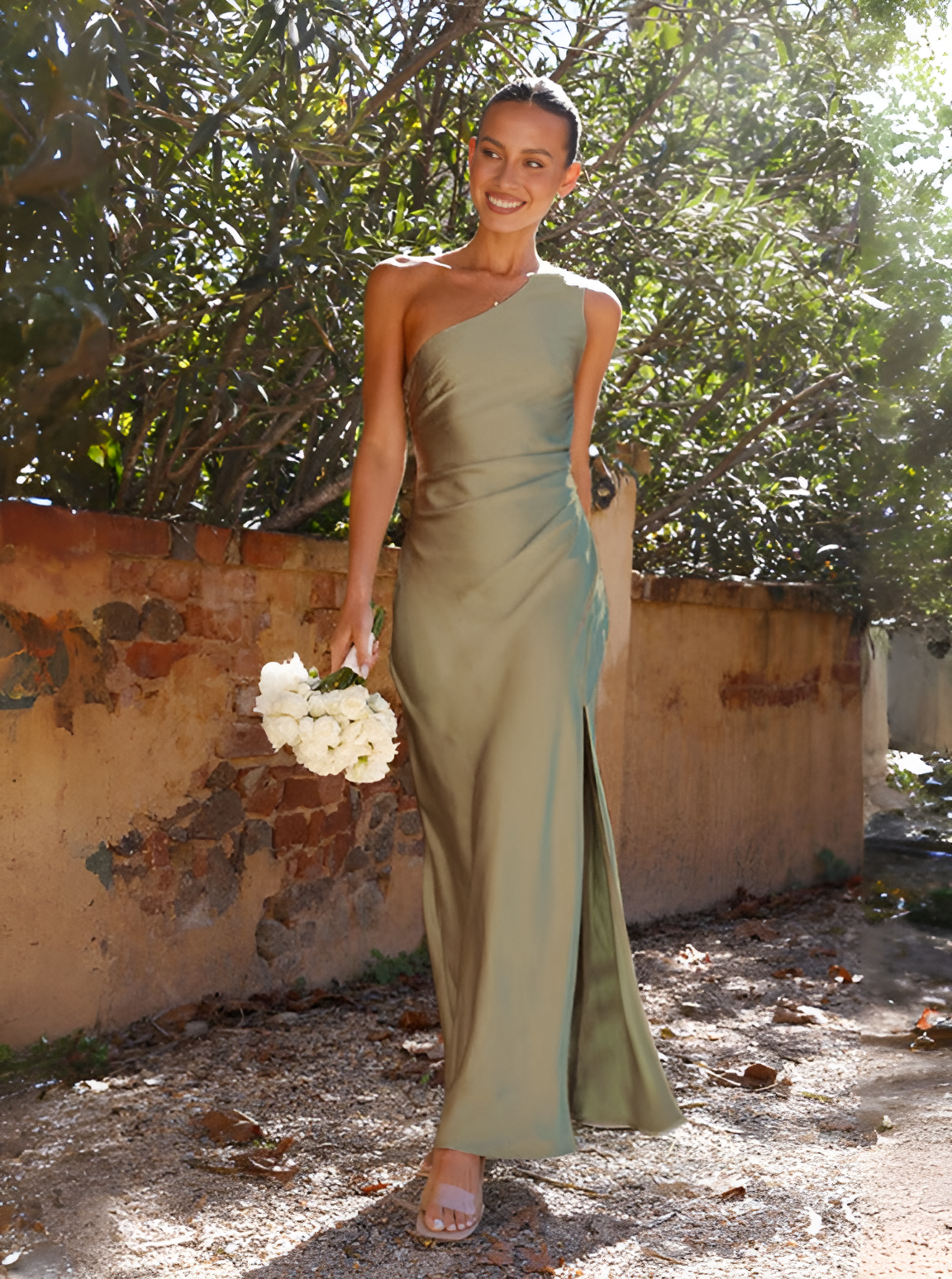 Asymmetrical maxi dress with exposed shoulder, featuring a flowing design suitable for formal events. 0