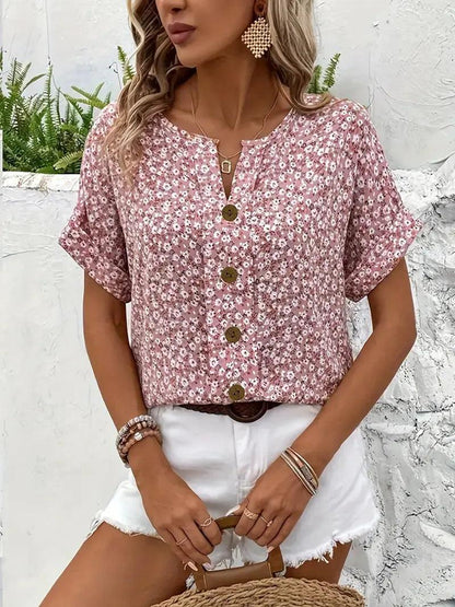 Long-sleeve women's blouse featuring a floral pattern, designed with a button-down front and a classic collar. 0