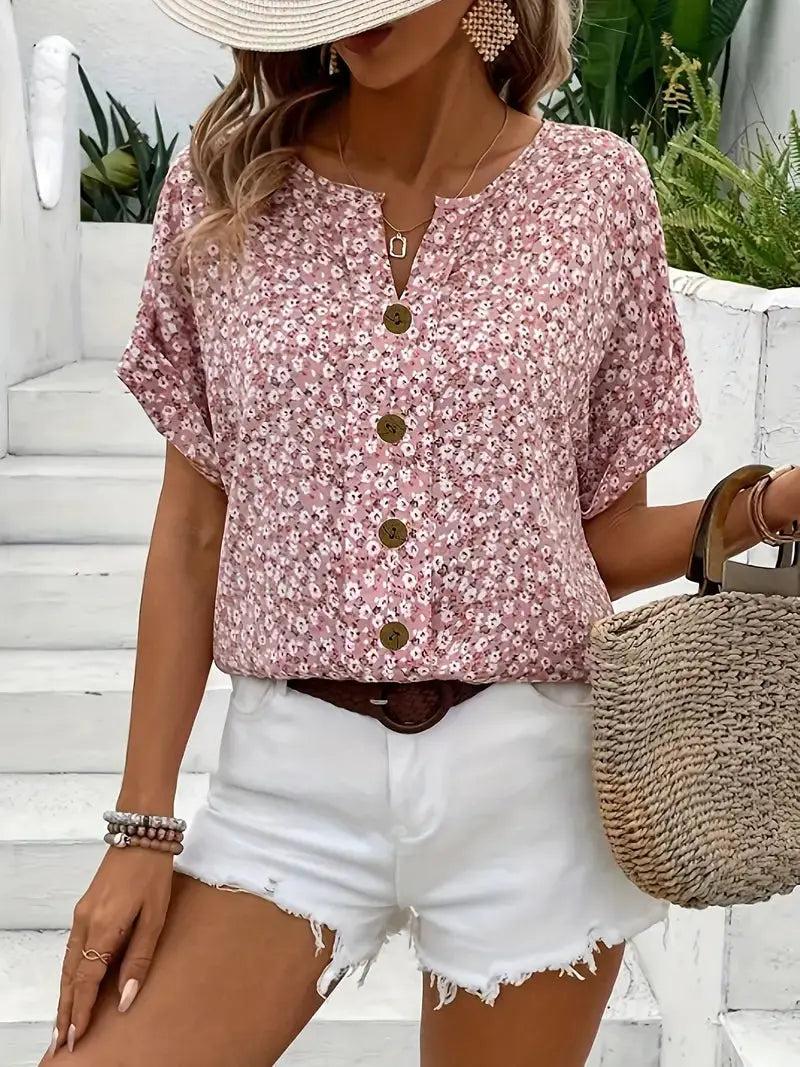 Long-sleeve women's blouse featuring a floral pattern, designed with a button-down front and a classic collar. 1