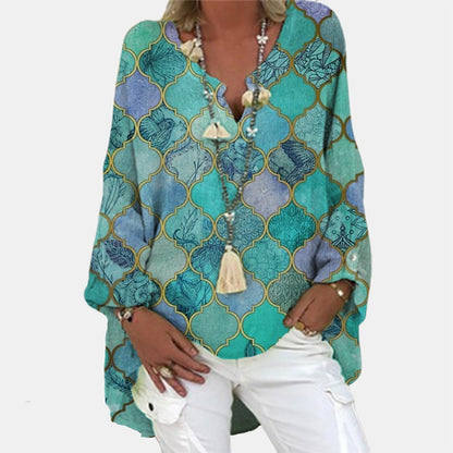 A women's summer blouse featuring a feminine cut, displayed on a mannequin in a simple setting. 3