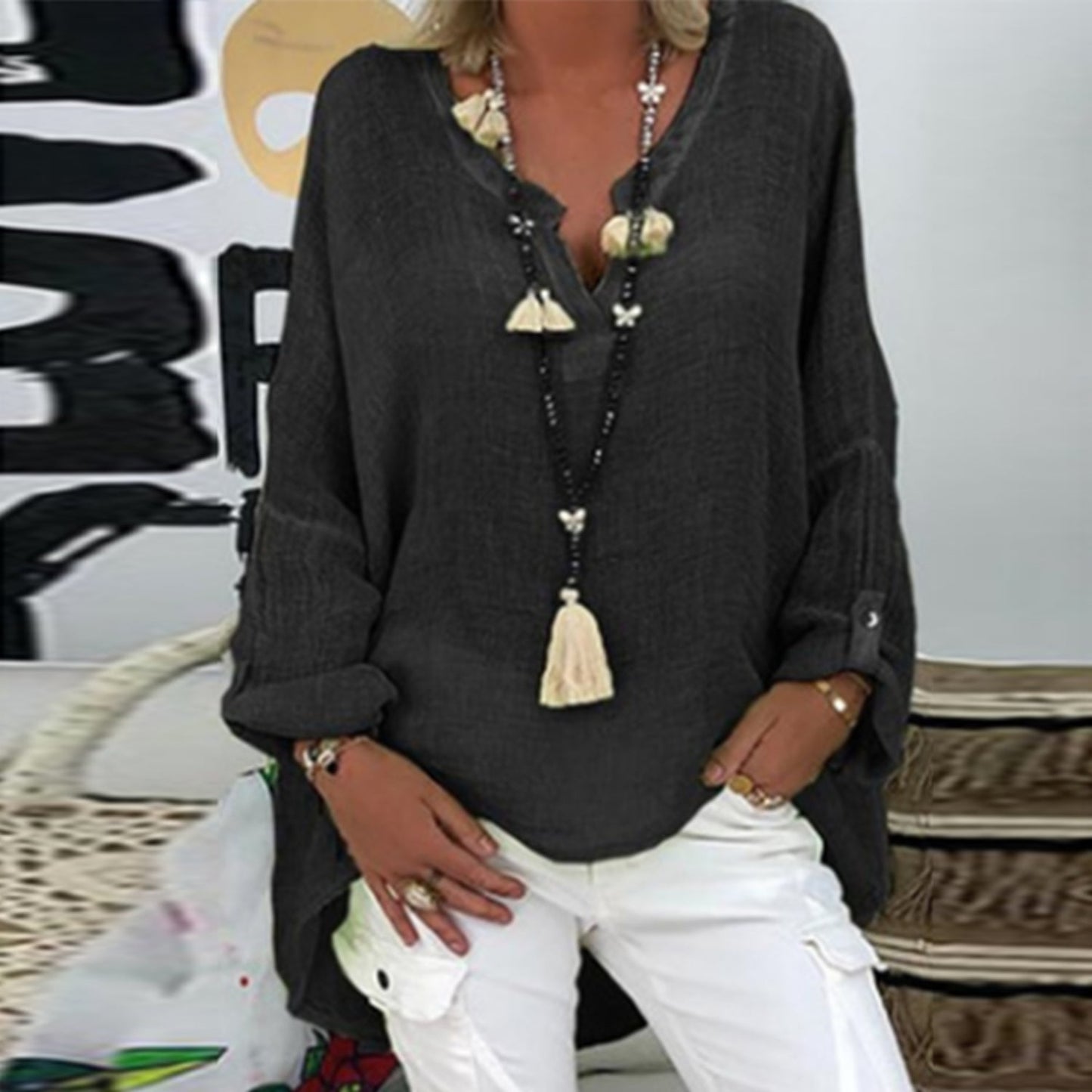 A women's summer blouse featuring a feminine cut, displayed on a mannequin in a simple setting. 5