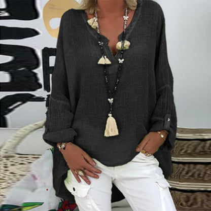 A women's summer blouse featuring a feminine cut, displayed on a mannequin in a simple setting. 5
