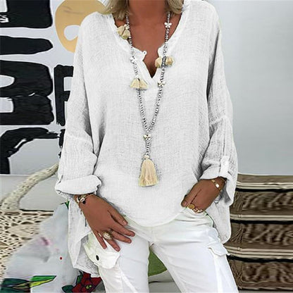 A women's summer blouse featuring a feminine cut, displayed on a mannequin in a simple setting. 7