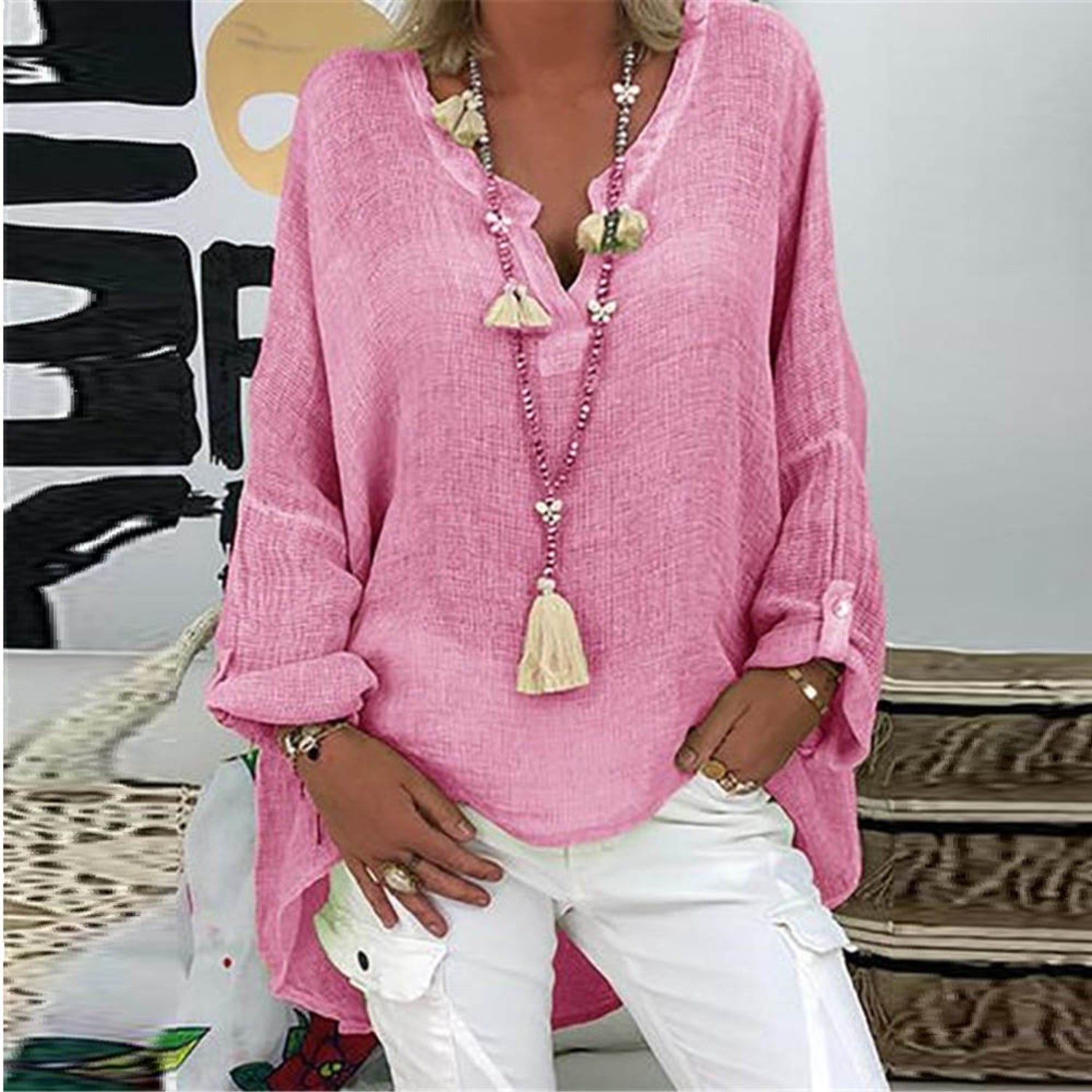 A women's summer blouse featuring a feminine cut, displayed on a mannequin in a simple setting. 8
