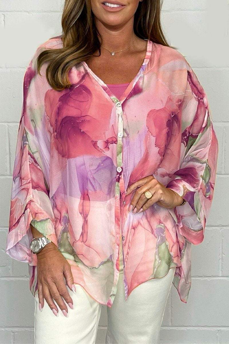 Loose-fitting women's summer blouse displayed on a mannequin, featuring short sleeves and a relaxed silhouette. 2