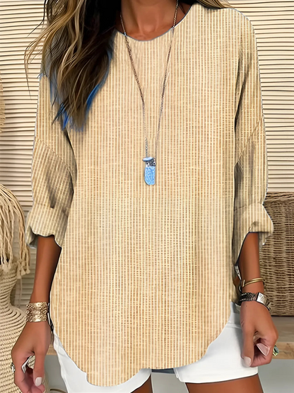 A women's long-sleeve blouse featuring vertical stripes, designed with an elegant and stylish look. 1