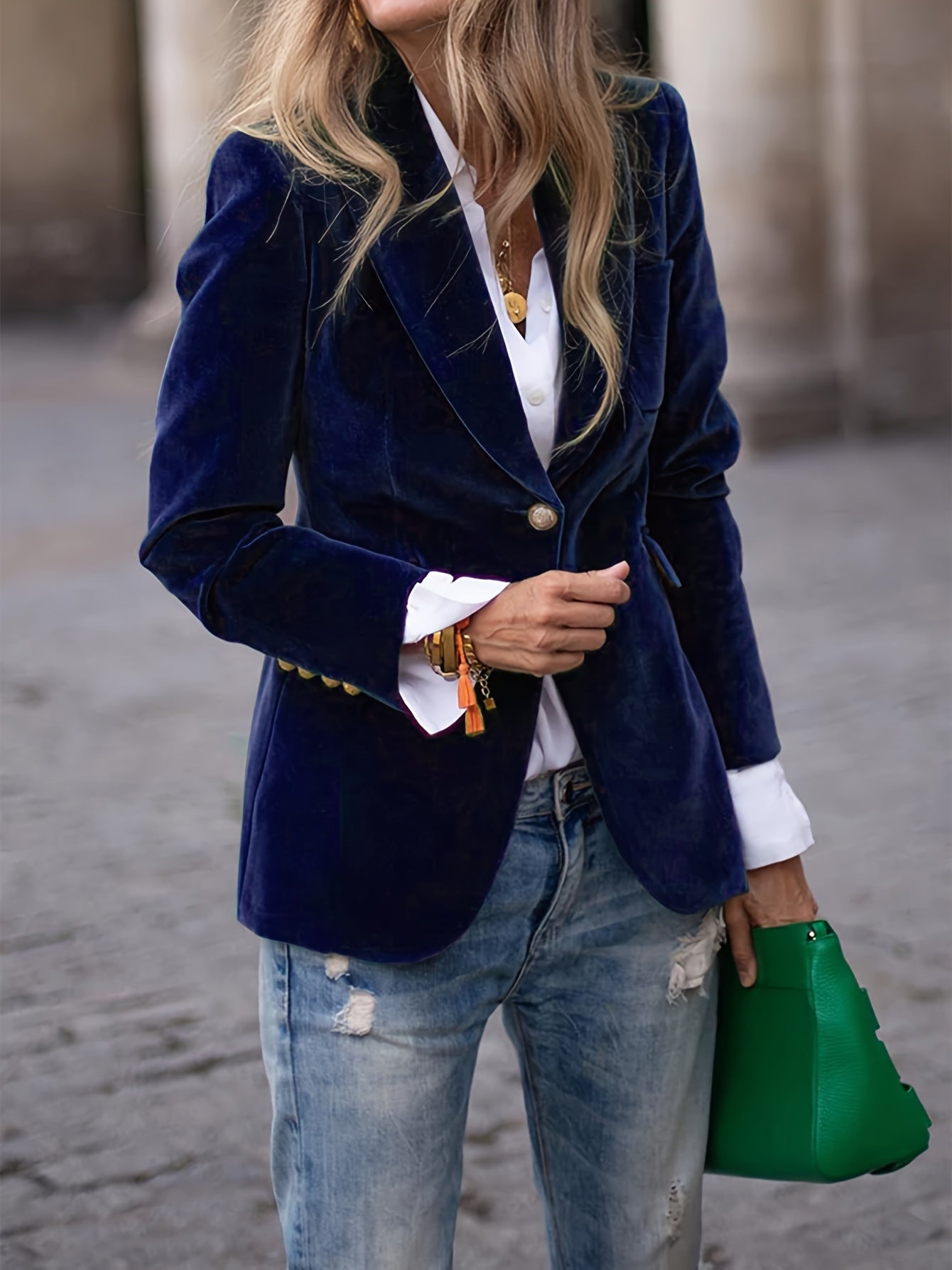Women's black blazer with button closure and classic collar, displayed on a hanger. 2