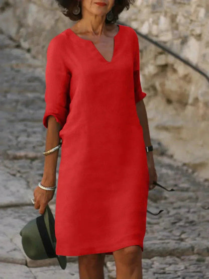 Women's black dress with three-quarter sleeves and a collar, featuring a simple and elegant design. 4