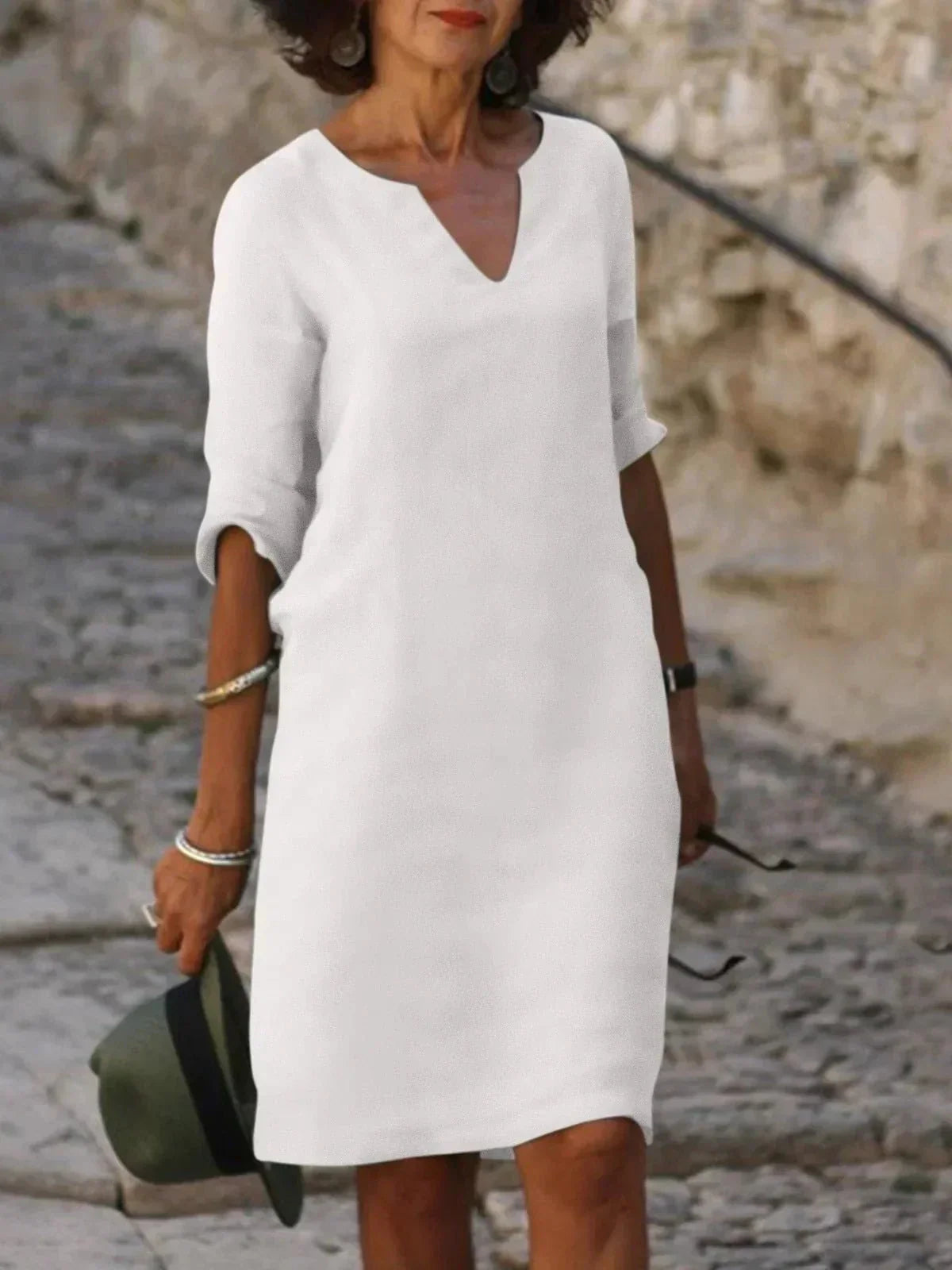 Women's black dress with three-quarter sleeves and a collar, featuring a simple and elegant design. 5