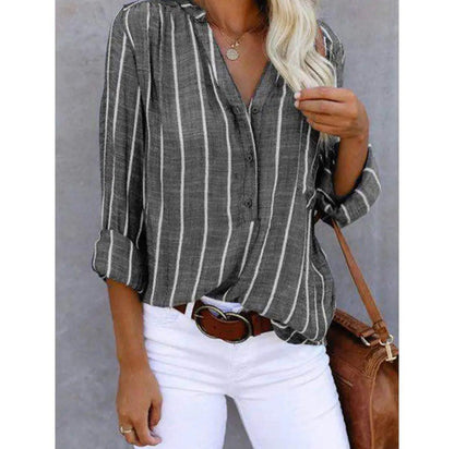 A loose-fitting women's summer blouse featuring a striped pattern. The blouse has short sleeves and a relaxed silhouette, suitable for casual wear. 8