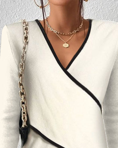 Women's long-sleeve blouse tied at the front, featuring a fitted design and a classic collar. 1