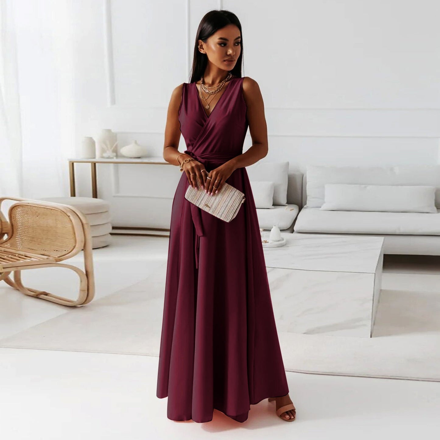 Long-sleeve maxi dress with a wrap design, featuring a flowing silhouette and a modest neckline. 2